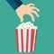 Hand and popcorn. Flat design style icon. Vector illustration