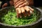 Hand position for grinding fine green chilies using traditional stone grinder