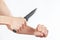Hand position to attack with a knife on white background