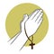 Hand Praying While Holding A Cross