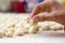 Hand preparing homemade italian gnocchi