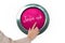 Hand pressing pink button for breast cancer awareness