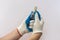 Hand in protective glove holding led halogen headlight bulb,isolated. car lighting technology  for repair