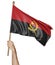 Hand proudly waving the national flag of Angola