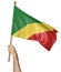 Hand proudly waving the national flag of Congo Republic