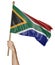 Hand proudly waving the national flag of South Africa