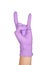 Hand in a purple latex glove isolated on white. Woman`s hand gesture or sign isolated on white