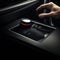 Hand Pushing on a smart start button on car control engine ignition for electric car automobile