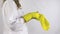 Hand put sterile yellow glove, exercises hands. White background