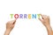 Hand put the word Torrent with magnetic letters