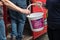 Hand putting a coin donation into a charity collection bucket. Alzheimers dementia