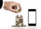 Hand putting coin and glass jar full of coins with mobile phone, isolated screen for copy space