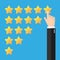 Hand putting five gold stars on blue background. Five stars quality rating icon.