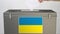 Hand putting paper ballot into ballot box with flag of Ukraine. Election related clip