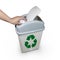 Hand putting a paper garbage into bin
