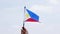 Hand raising flag of Philippines outdoors