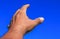 Hand reach up blue sky background