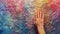A hand reaching out to touch a colorful wall, AI