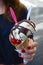 Hand with red nails hanging ice cream with chocolate  cherries and two spoons