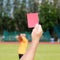 Hand of referee with red card