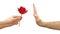 Hand refuses a flower or declines gift isolated on