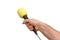 Hand of reporter with yellow microphone on white