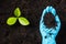 Hand of researcher woman holding compost fertile black soil