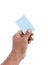 Hand right to hold blue credit card, blank paper on white background