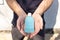 Hand sanitizer alcohol gel rub clean hands hygiene prevention of coronavirus virus outbreak. Man holding bottle of antibacterial