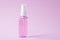 Hand sanitizer bottle, antiseptic spray for disinfection. Flacon on a pink background. Cleanser product. Antibacterial transparent