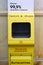 Hand sanitizer in the Moscow metro, disinfection of passengers on public transport. Yellow automatic machine for hand hygiene -