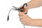 Hand with scissors and computer cable