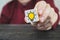 Hand selected wooden cubes with yellow light bulb symbol on wooden table. New idea, concepts of innovation and solutions