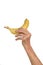 Hand of senior woman and banana isolated