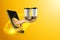 Hand serves coffee in cups via smartphone on yellow background. The concept of food delivery, online ordering, restaurant services