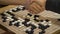 Hand shake before play Chinese board game Go or Weiqi