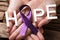 Hand Showing Ribbon With Hope Text