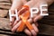 Hand Showing Ribbon With Hope Text