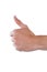 Hand showing thumbs up against white background