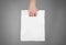 Hand shows blank plastic bag mock up isolated. Empty white polyethylene package mockup. Consumer pack ready for logo design or id