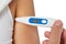 Hand of sick woman holding digital thermometer in armpits isolated