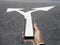 Hand with smart phone and two way arrow directions from phone to road, business concept