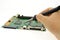 Hand soldering solder of electronics board, repairs, or manufacturing