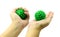 Hand with Spiny plastic green massage ball isolate on white