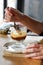 Hand with spoon taking Affogato coffee