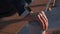 hand of sportsman with smartwatch during workout outdoors, closeup