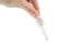 Hand squeezes a clear liquid out of the pipette. Isolated on a white background