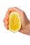 Hand squeezing a lemon