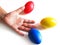 Hand and stress balls colored yellow, red, blue, squeeze ball for hand exercise.