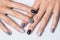 Hand with a stylish gray manicure isolated on